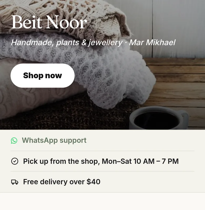 A shop’s page on a phone: products with photos and prices, a cart and a WhatsApp button.